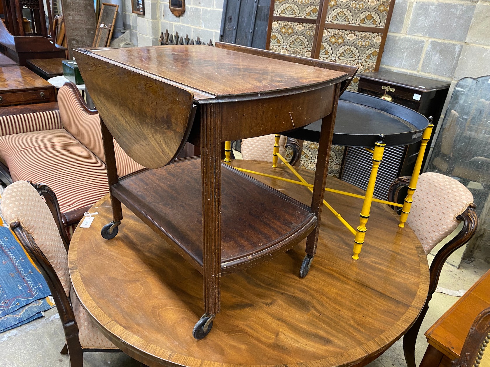 A mahogany drop flap tea trolley, width 69cm, depth 51cm, height 59cm